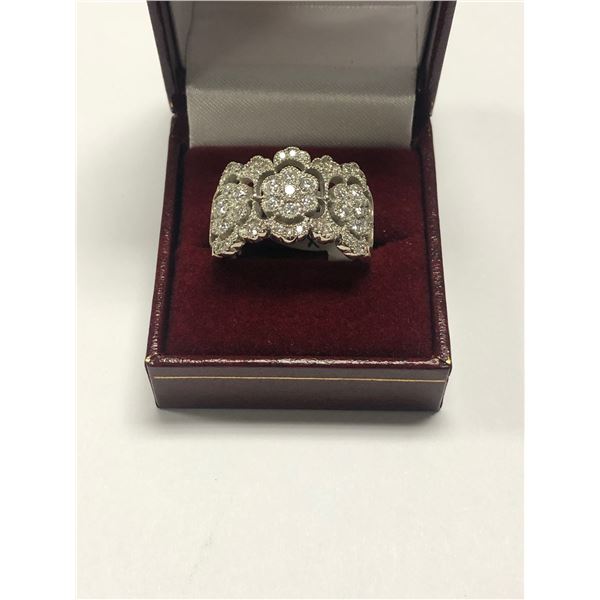 $9,000 Lady's stamped 14K, custom made, white gold, wide style, diamond floral band with open cut-ou