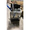 Image 2 : ROLLING RACK OF SIZE LARGE RAIN SUIT, NECK MASSAGER GRILL AND MORE
