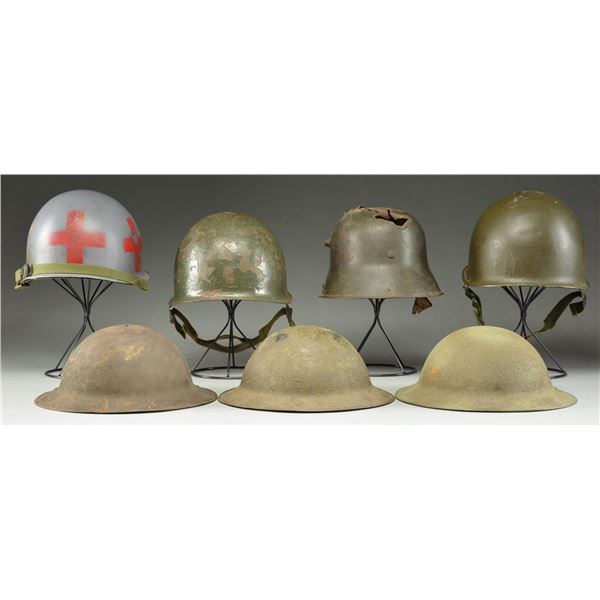 7 MILITARY HELMETS.
