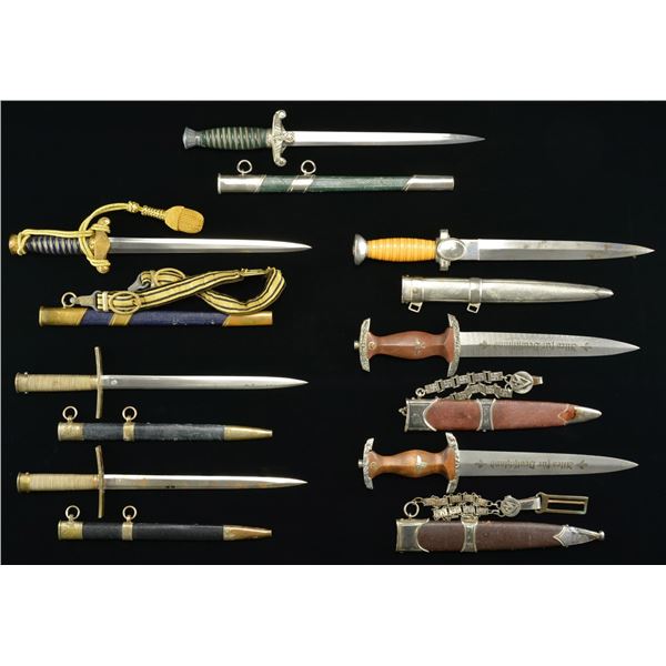 7 REPRODUCTION WWII GERMAN DAGGERS.