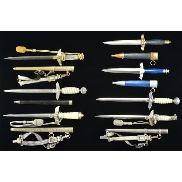 7 REPRODUCTION WWII GERMAN DAGGERS.