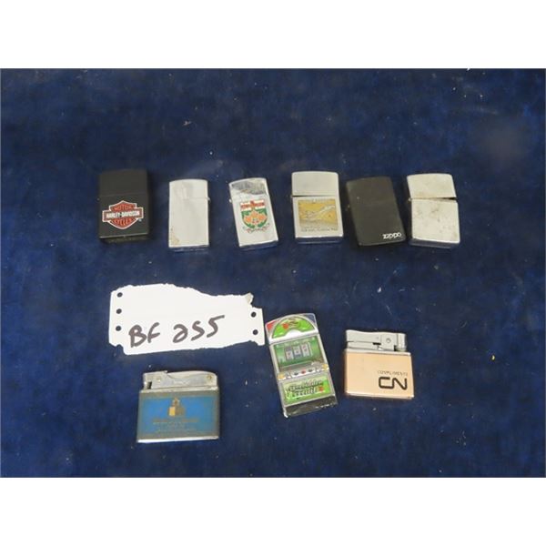 9 Lighters: Top Row, 6 Zippos, Lark, Golden Bell + ??