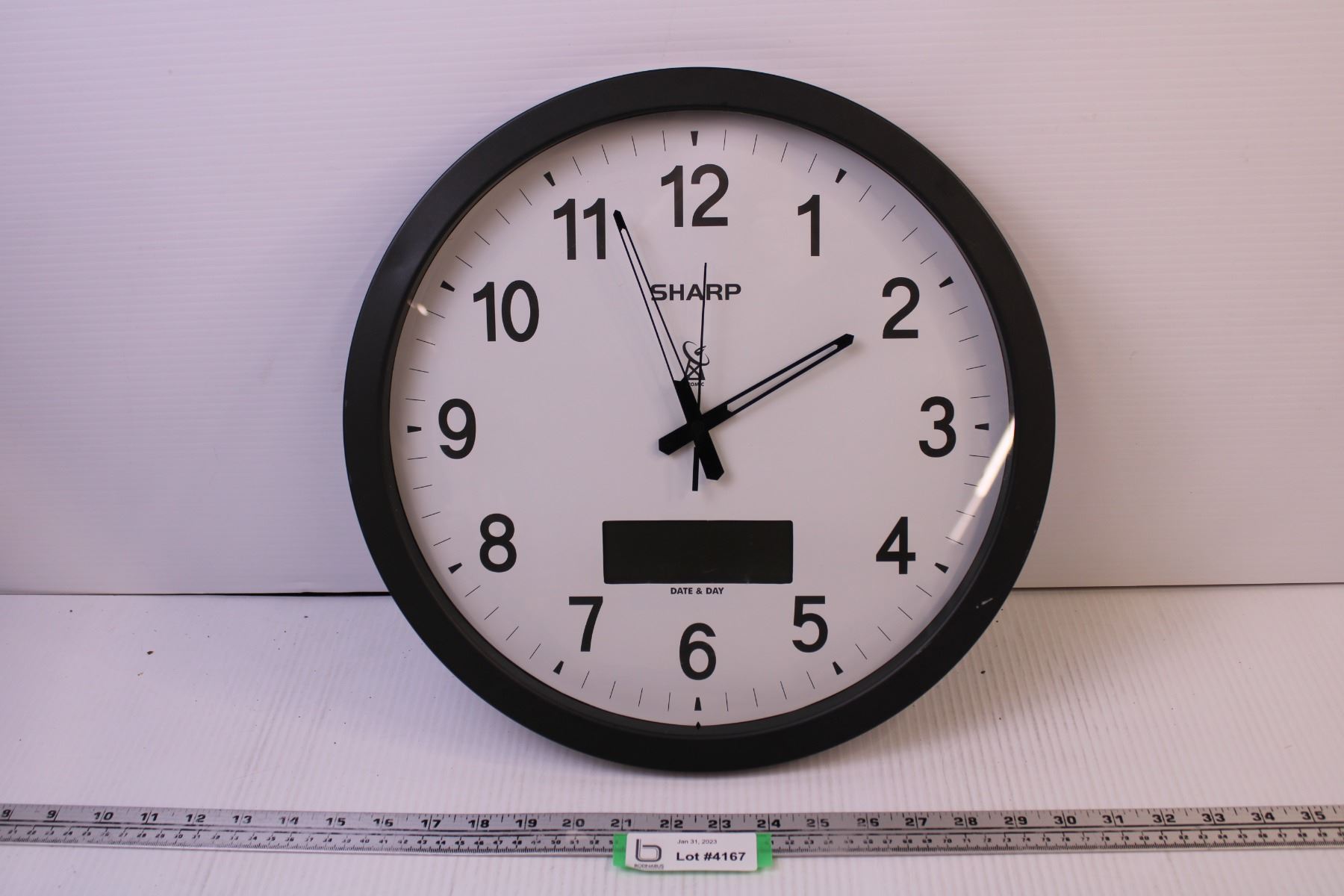 Sharp Wall Clock - Bodnarus Auctioneering