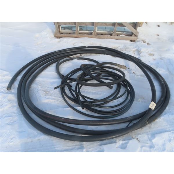 Pile of Black PVC Hose