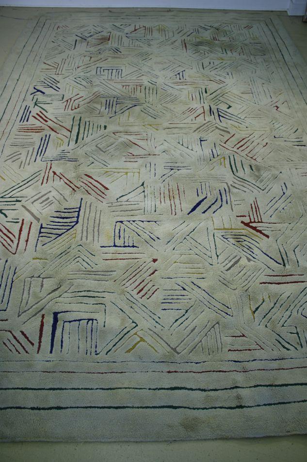 An Edward Fields Rug with Colored Geometric Design on Ivory Field.