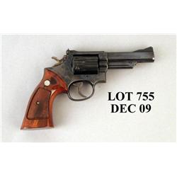 S&W Model 19-4 Revolver .357 Mag. #46K4223. 4” heavy barrel with extractor shroud. Blued finish, che
