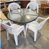 Image 1 : GLASSTOP PATIO TABLE AND 4 STACKING CHAIRS
