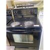 Image 1 : FRIGIDAIRE GALLERY SERIES GLASS TOP 4 BURNER 1 WARMER STOVE WITH CONVECTION OVEN (REQUIRES CLEANING)
