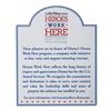 Image 1 : A "Heroes Work Here" Sign.