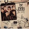 Image 1 : INXS signed The Swing album