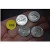 Image 1 : Four silver Canada quarters