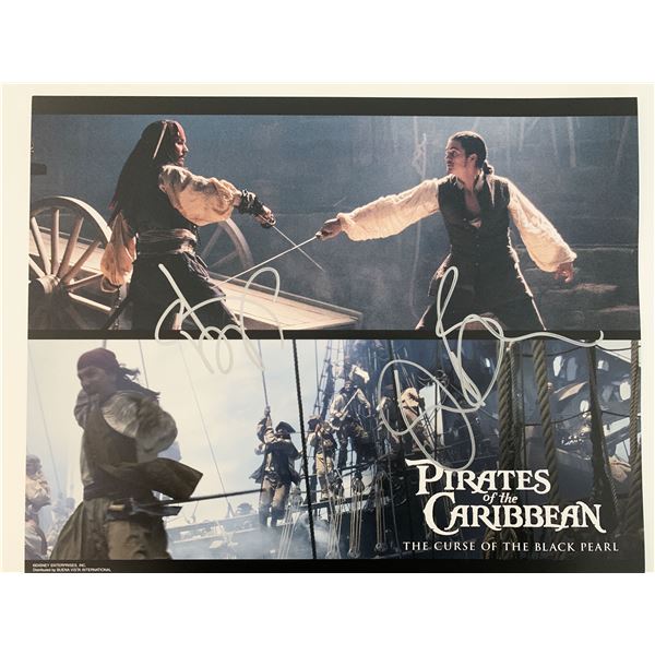 Pirates of the Caribbean: The Curse of the Black Pearl Johnny Depp and Orlando Bloom signed lobby ca