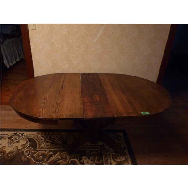 Wood pedestal dining room table with three leaves