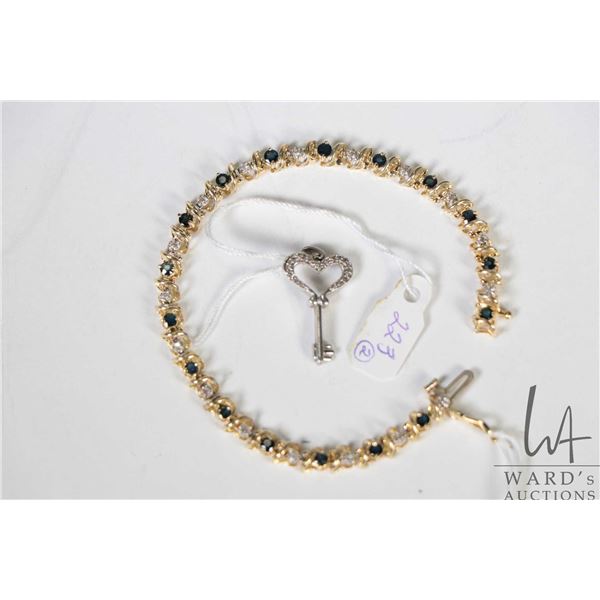 10kt yellow gold, diamond and sapphire gemstone set bracelet, 7  in length plus a small key charm/ p