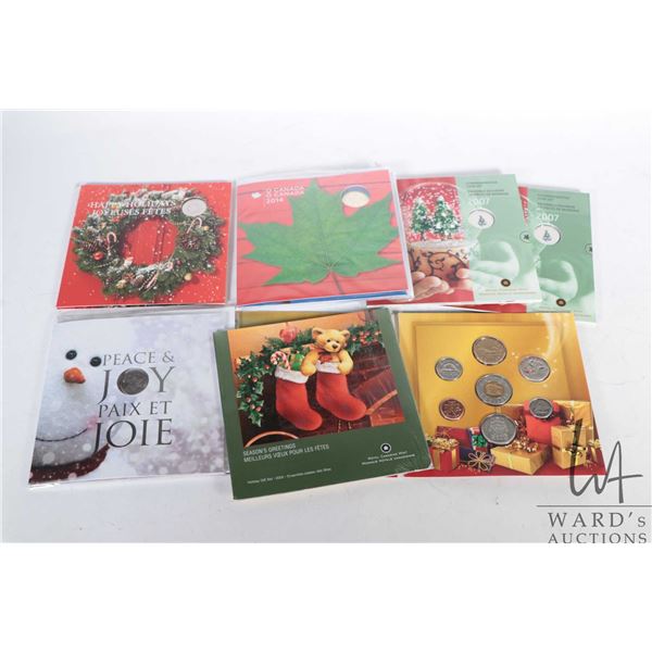 Seven Canadian Specimen sets including 2005, 2006, two 2007, 2011, 2013, 2014, all in holiday theme 