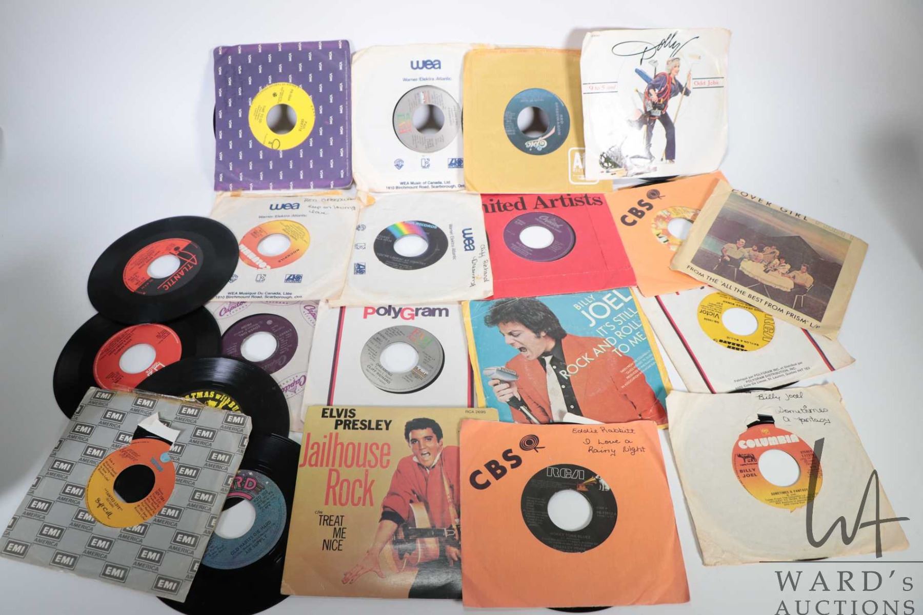 Selection of 45 rpm records including Elvis, Eddie Rabbit, Steve Miller ...