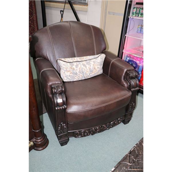 Modern full sized sofa and parlour chair with carved show wood and throw pillows