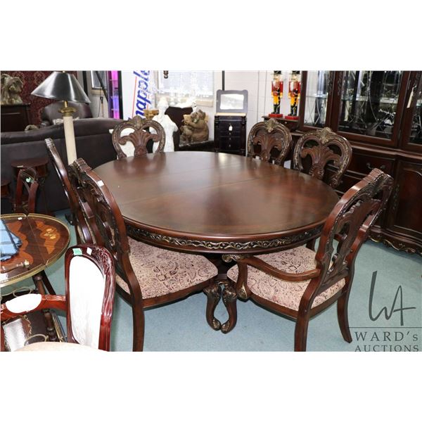 Modern ornately carved dining set including 60" center pedestal round table with 16" insert leaf and