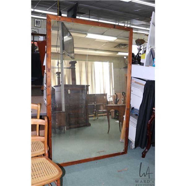 Large antique wood framed mirror with age appropriate distressed silvering, 75  X 48  outside dimens