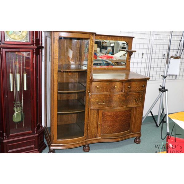 Antique quarter cut oak side X side with three serpentine drawers, curved raised panel door, curved 