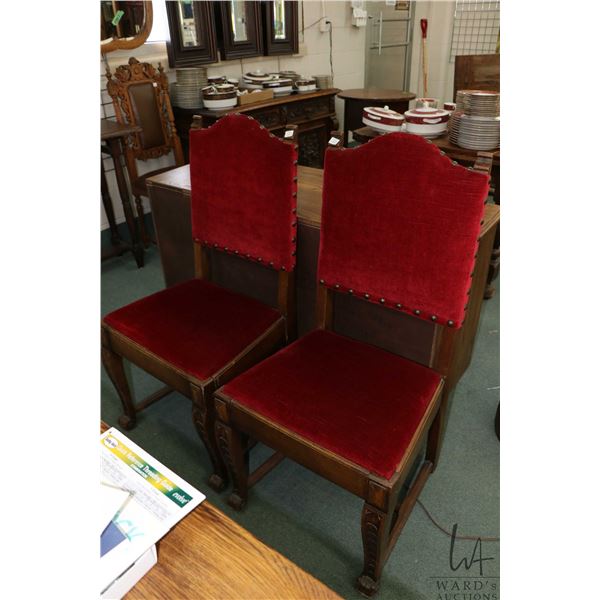 Two antique oak dining chair with decorative carved front supports, velvet upholstered seat and back