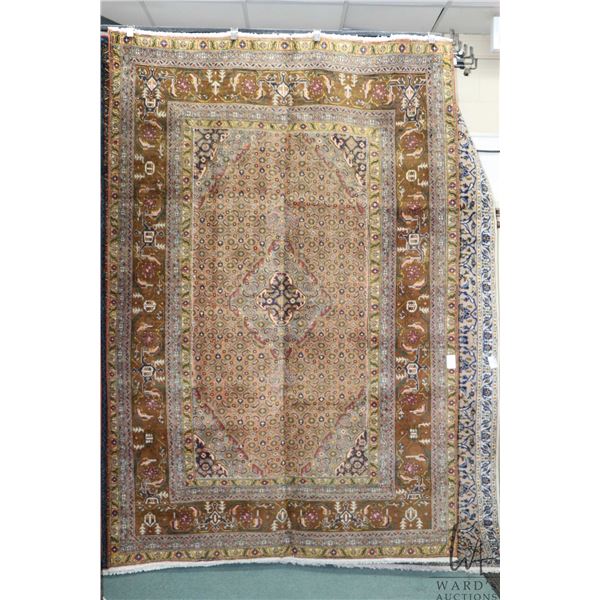 100% Iranian wool carpet "Ardedil" with overall gold colour, center medallion and highlights of blue