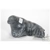 Image 1 : Carved soapstone walrus, signed in syballlics and 7" in length