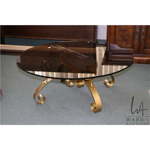 Two vintage smoked glass top tables on gold painted flat iron bases including 40  diameter coffee ta