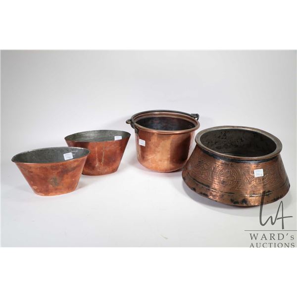 Four pieces of vintage copper including hand hammered and hand chased pot, two small oval bowls and 