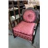 Image 1 : Antique rocking chair with caned back and cushioned seat, includes matching throw cushion