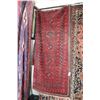 Image 1 : Vintage wool area carpet with multiple medallions and red background, highlights of black, taupe etc