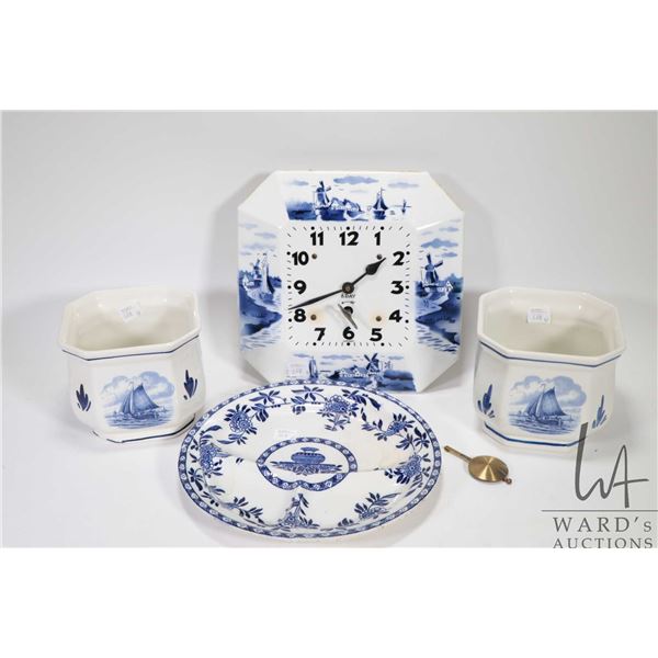 Three pieces of Delft pottery including a pair of matching hand painted and transfer ware planters, 