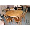 Image 1 : 46" diameter center pedestal oak dining table with 10" skirted insert leaf and carved paw feet plus 