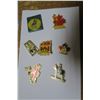 Image 6 : RCMP lot, lapel pins, book, metal logo, key chain, post cards