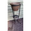 Image 1 : Vintage heavy metal plant stand on original metal castors. 30 1/2” high