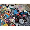 Image 6 : Junk drawer items in a large tub.