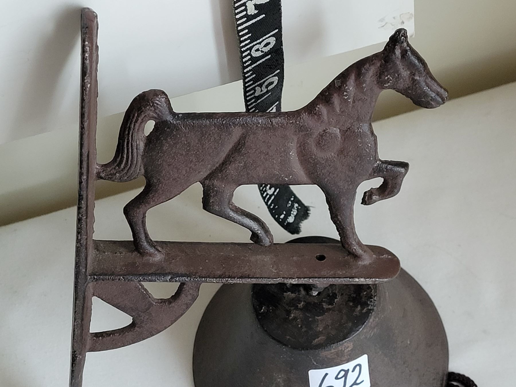 Cast iron, wall mount, horse ranch dinner bell. - Schmalz Auctions