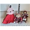 Image 1 : Porcelain head dolls & clown. One doll made in Cuba. Small wicker chair.