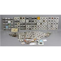 Large group of assorted world coins in sleeves and envelopes