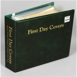 Album of some seventy (70) first day issues and assorted postcards