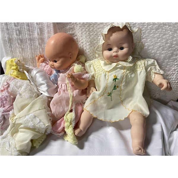 Bag of Vintage Baby Clothes and two Vintage Dolls