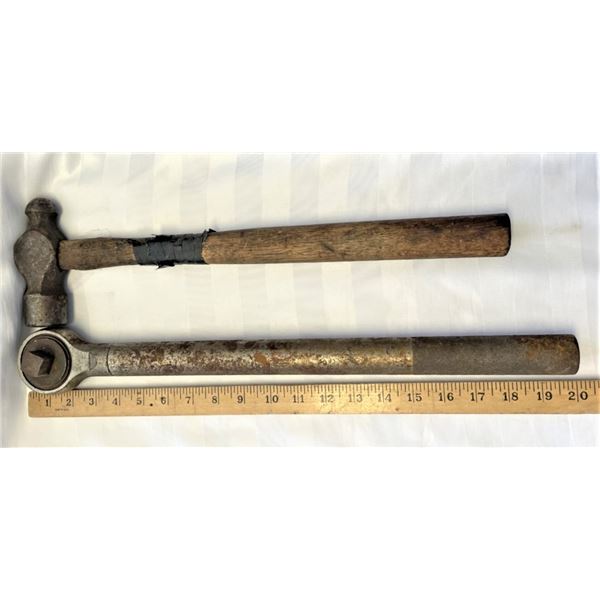 One large Socket Wrench and a Hammer