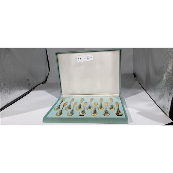 A Collection of Gold Plated Spoons with Provincial-Themed Insignia.