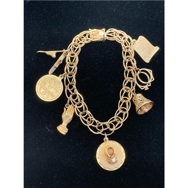 14K CHARM BRACELET WITH SEVEN 10K+ CHARMS (30.7G)