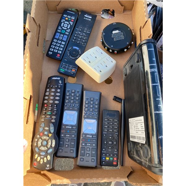 Assorted remotes and telus item