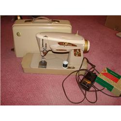 Singer Sewing Machine w/Attachments