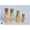 Image 1 : 4 GOLD FOIL FLAKES IN GLASS BOTTLES
