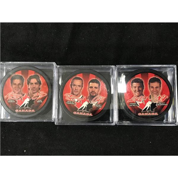 LOT OF TEAM CANADA HOCKEY PUCKS