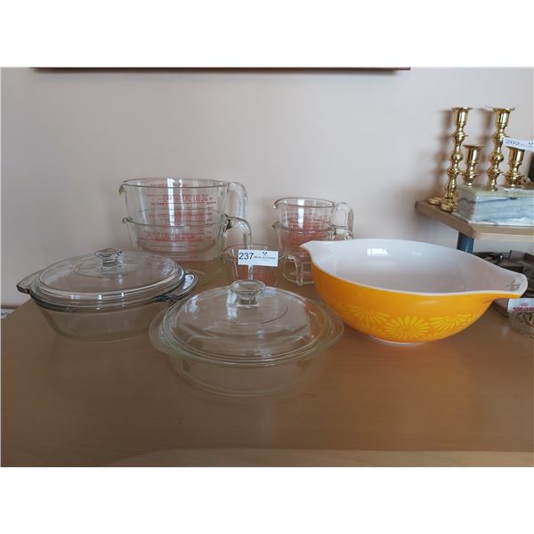 Five Pyrex Measuring Cups With Two Casserole Dishes And One Pyrex Mixing Bowl