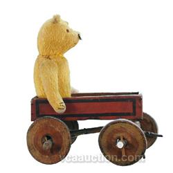 Old Stuffed Toy Bear In Old Little Wooden Wagon